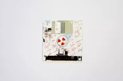 Atomic power, or nuclear power plants, are obsolete - silk screened on 3.5" floppy disk Atomic power, or nuclear power plants, are obsolete - silk screened on 3.5" floppy disk
